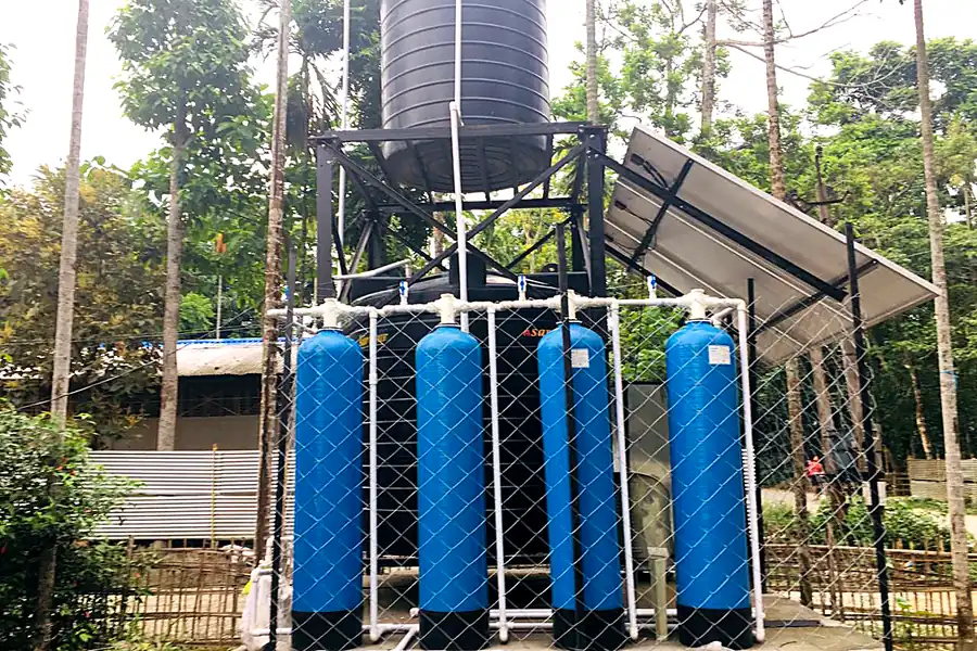 Iron removal filtration units with solar panel and overhead tank